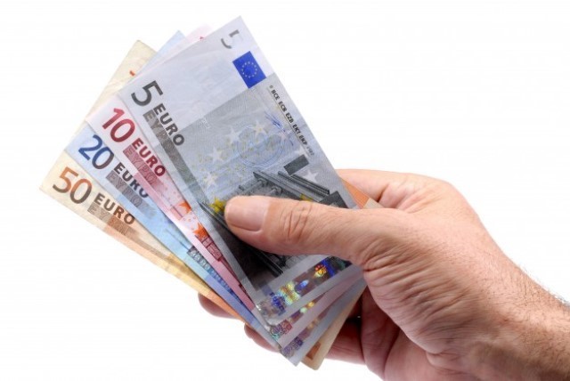 hand-holding-euros-currency_1101-411.jpg